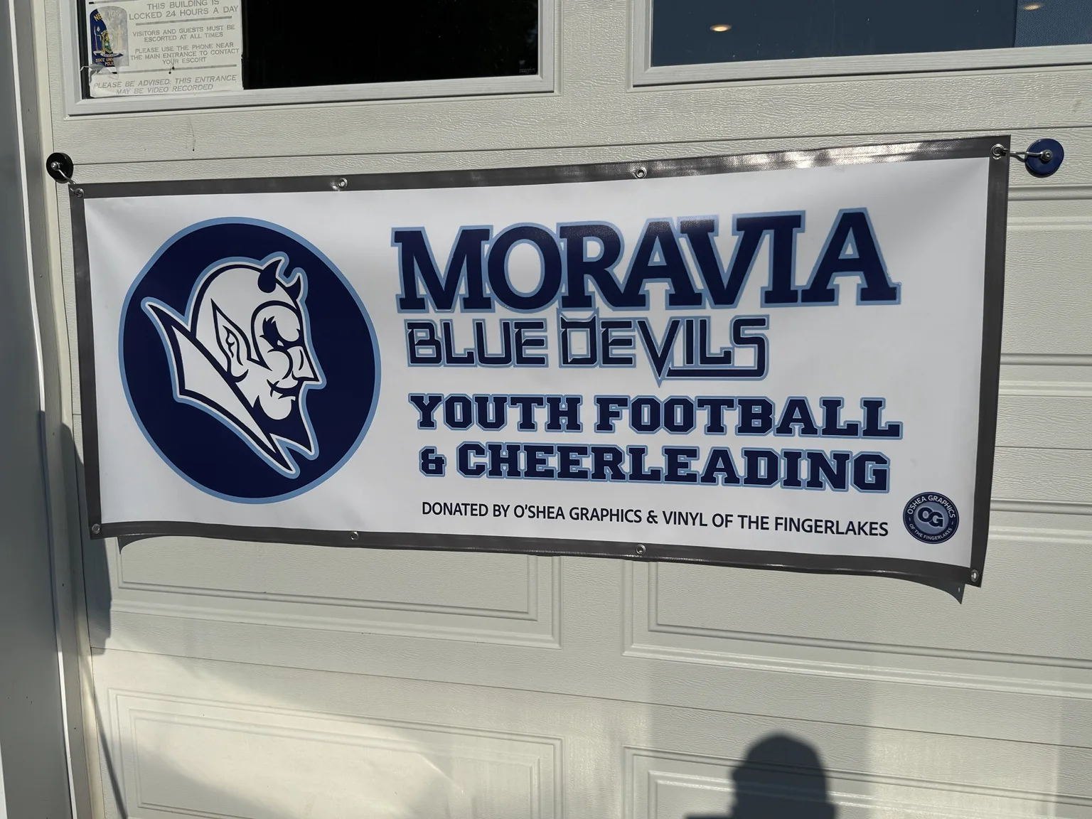Moravia Blue Devils youth football and cheerleading banner